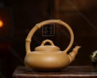 《弯把提梁》
